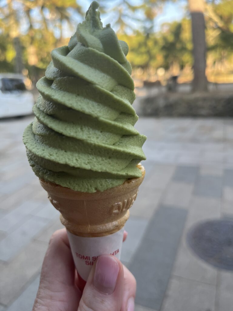 Swril of green tea, matcha soft ice cream in the foreground.