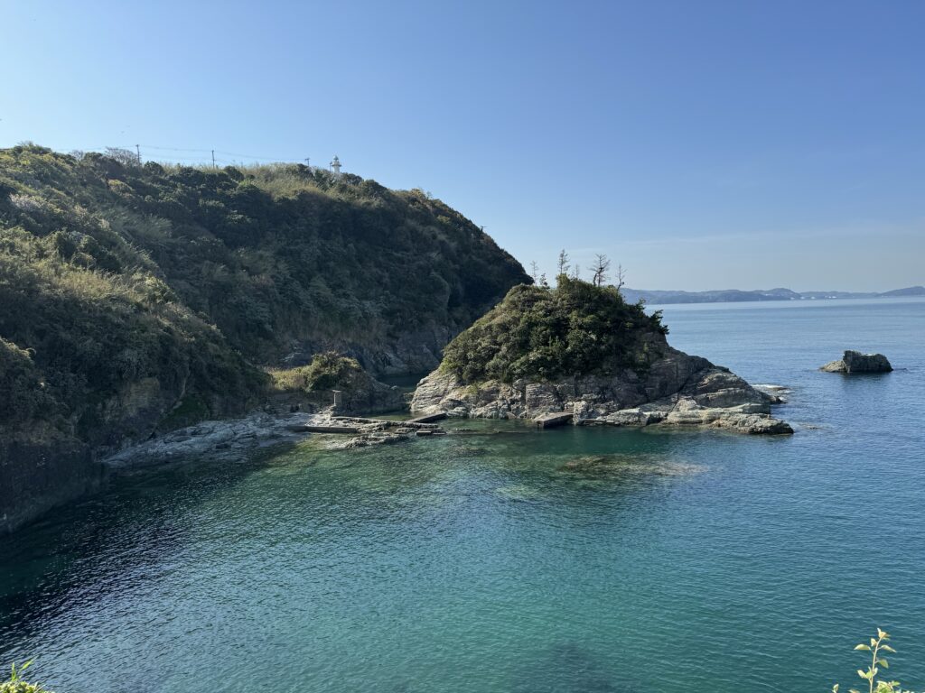 Ocean view with rocks covered in lush greenery near Wakayama.