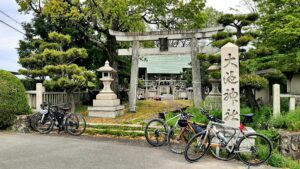 A small Shinto shrine found in the countryside of Japan. With bikes parked outside the Tori gate.