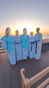 Beautiful woman pose in traditional Japanese Yukatta's with a sunset in the background.