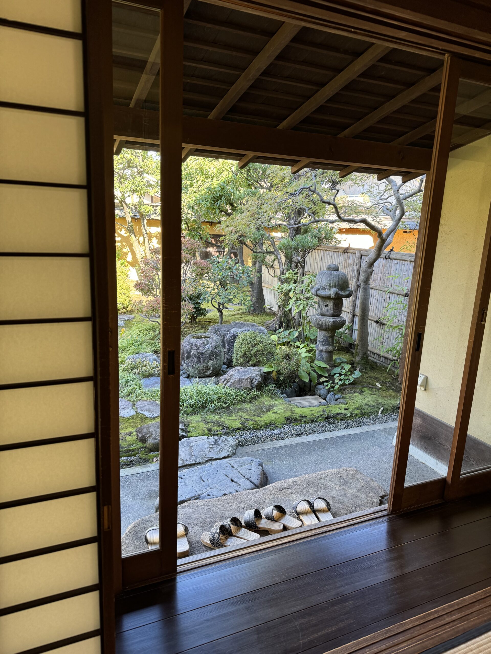 View from inside Japanese traditional home of exterior Japanese garden.