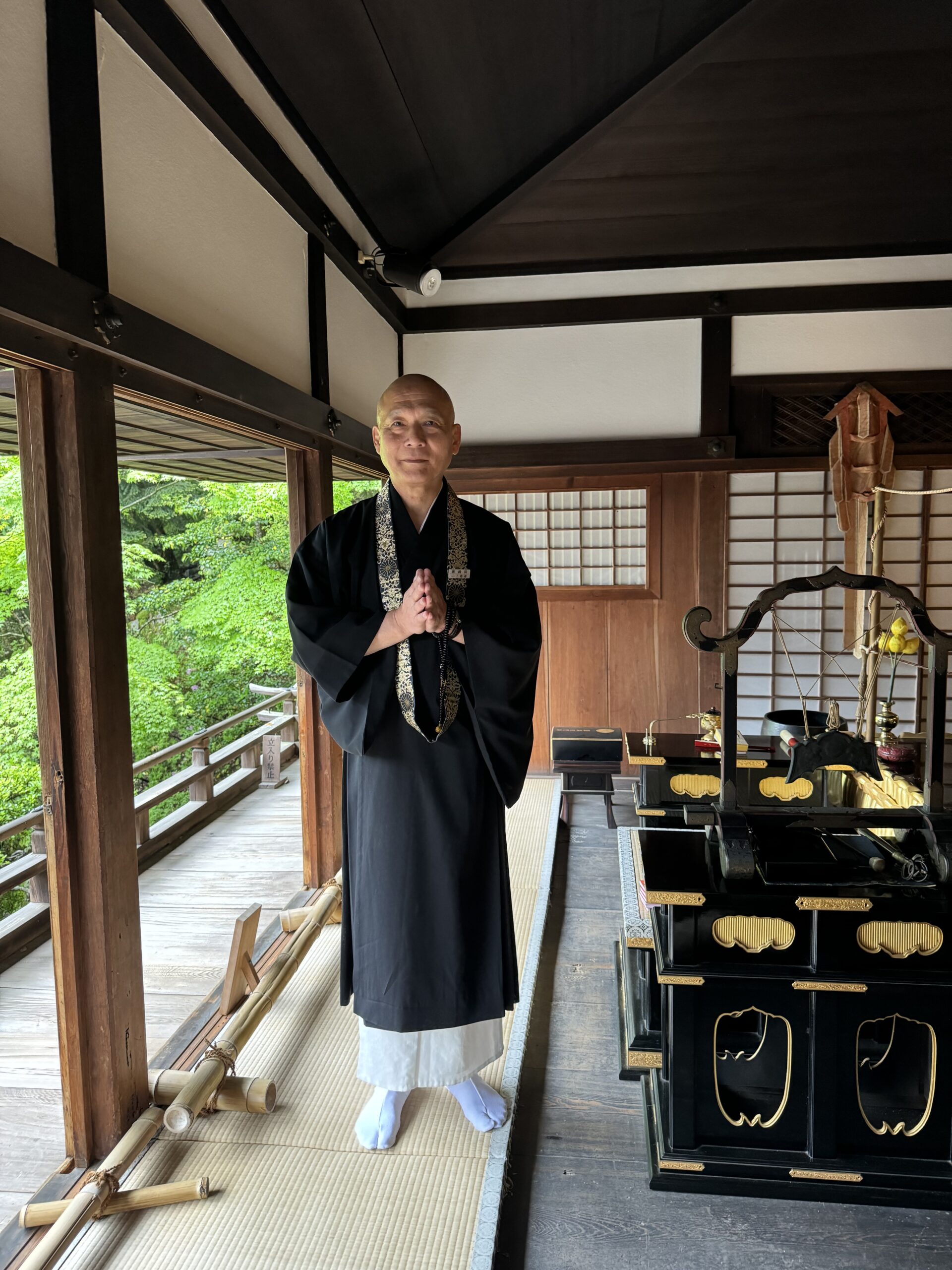 Priest stands in temple.